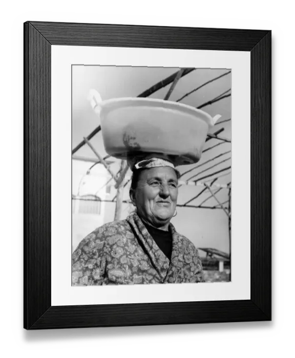 Framed Print : Woman with wet washing on her head, Italy Framed Print : Woman with wet washing on her head, Italy