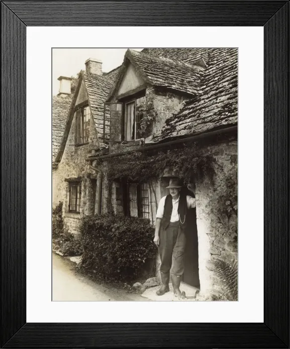 Framed Print : Man in cottage doorway, Arlington Row, Bibury, Glos Framed Print : Man in cottage doorway, Arlington Row, Bibury, Glos