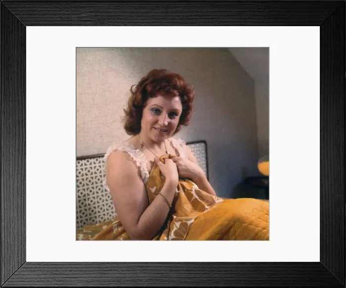 Framed Print : Young woman in a nightie sitting up in bed Framed Print : Young woman in a nightie sitting up in bed