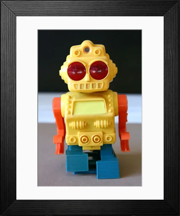 Framed Print : Retro Toy Walking Plastic Robot - Yellow Body (2 / 3) Framed Print : Retro Toy Walking Plastic Robot - Yellow Body (2 / 3)
