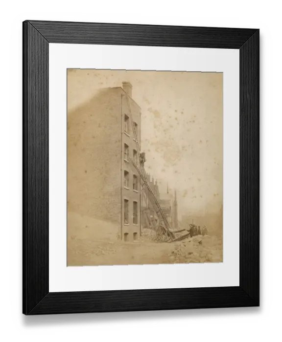 Framed Print : A firefighter in action on a wheeled ladder escape Framed Print : A firefighter in action on a wheeled ladder escape