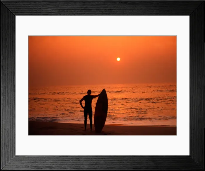 Framed Print : Surfer standing admiring a Cornish Sunset Framed Print : Surfer standing admiring a Cornish Sunset