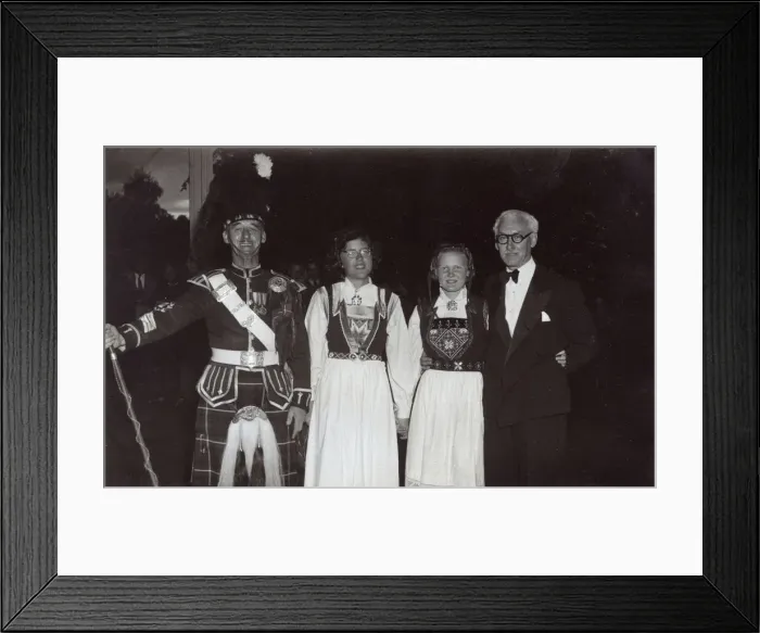 Framed Print : Scotsman in dress uniform with two girls and a man Framed Print : Scotsman in dress uniform with two girls and a man