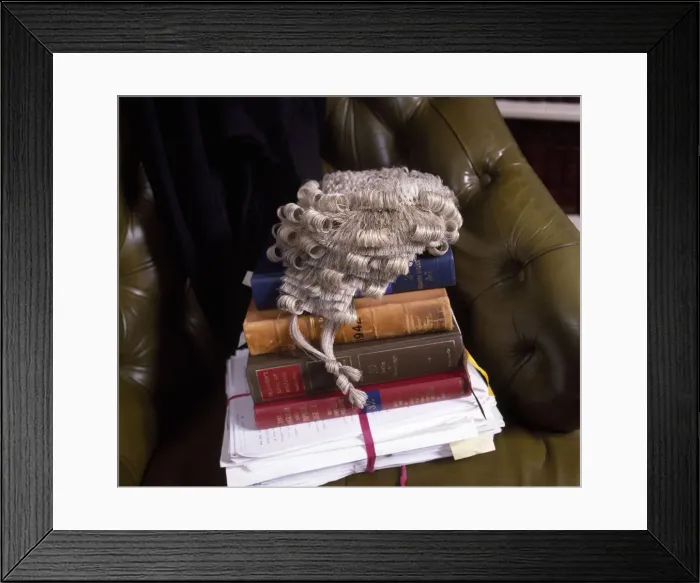 Framed Print : Lawyers books, brief and wig in a leather chair Framed Print : Lawyers books, brief and wig in a leather chair
