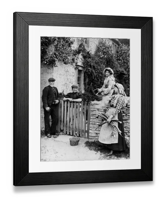 Framed Print : Villagers chatting over cottage gate, 1890s Framed Print : Villagers chatting over cottage gate, 1890s