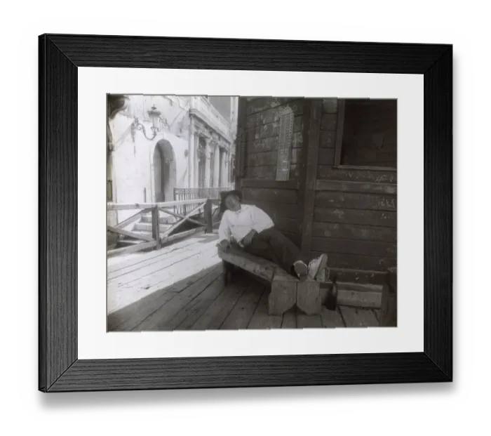 Framed Print : Man sleeping on a bench in a side street, Venice, Italy Framed Print : Man sleeping on a bench in a side street, Venice, Italy