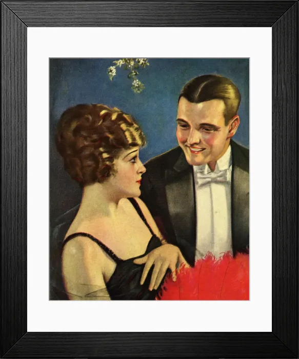 Framed Print : Couples. Couple in evening dress beneath the mistletoe Framed Print : Couples. Couple in evening dress beneath the mistletoe