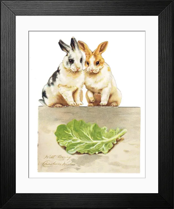 Framed Print : Two rabbits with lettuce on a cutout Christmas card Framed Print : Two rabbits with lettuce on a cutout Christmas card