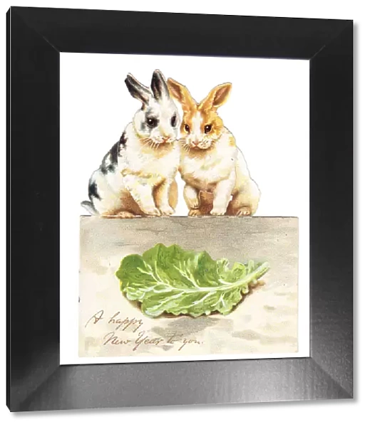 Two rabbits with lettuce on a cutout New Year card