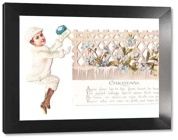 Boy and girl with floral trellis on a cutout Christmas card