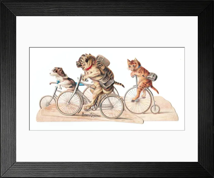 Framed Print : Cats and dogs on bicycles on a cutout Christmas card Framed Print : Cats and dogs on bicycles on a cutout Christmas card