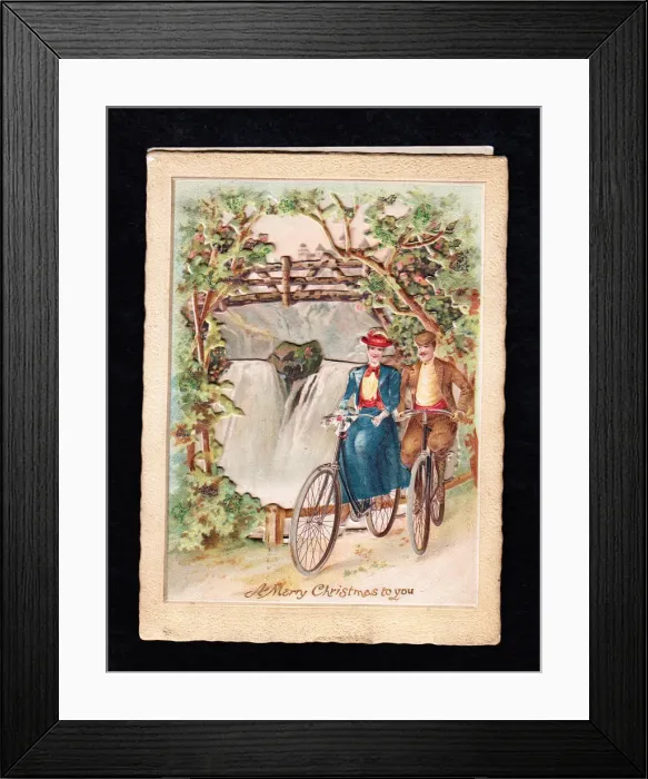 Framed Print : Couple riding bicycles on a Christmas card Framed Print : Couple riding bicycles on a Christmas card