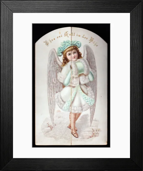 Framed Print : Angel with coat and hand muff on a German Christmas card Framed Print : Angel with coat and hand muff on a German Christmas card