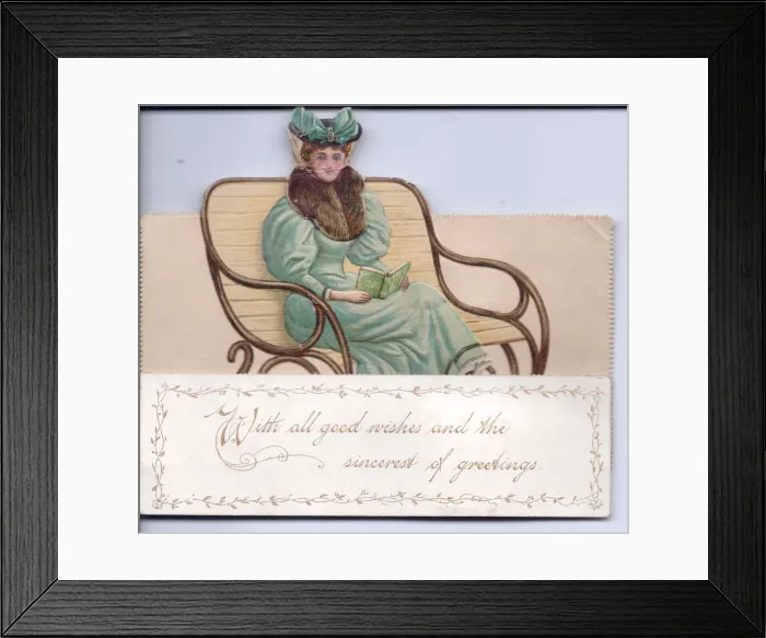 Framed Print : Lady on a bench reading a book on a cutout greetings card Framed Print : Lady on a bench reading a book on a cutout greetings card
