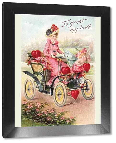 Cupid and woman in a car on a Valentine postcard