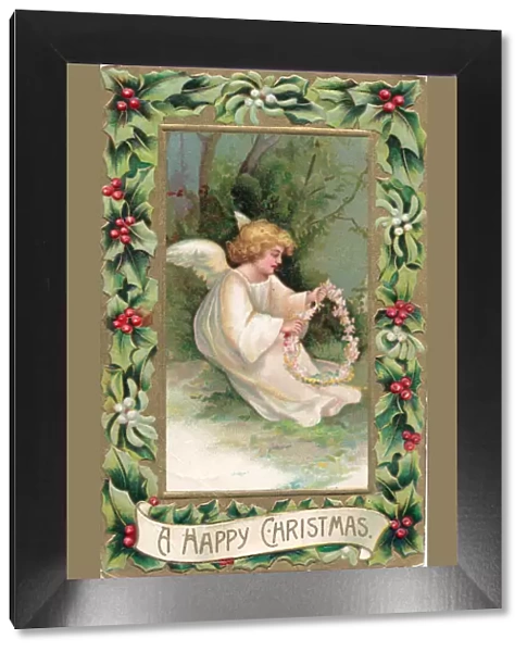 Angel in the snow on a Christmas postcard