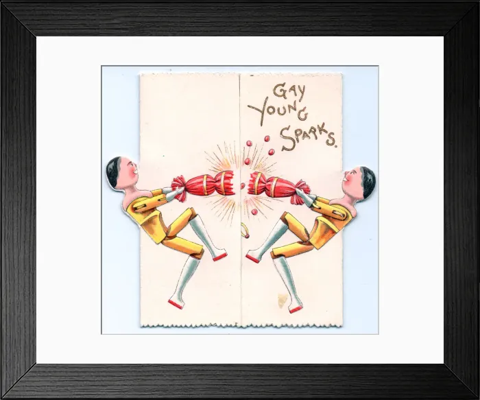 Framed Print : Two wooden dolls pulling a cracker on a greetings card Framed Print : Two wooden dolls pulling a cracker on a greetings card