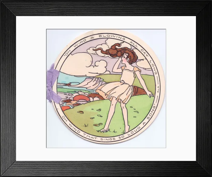 Framed Print : Girl on cliffs on a windy day on a circular greetings card Framed Print : Girl on cliffs on a windy day on a circular greetings card