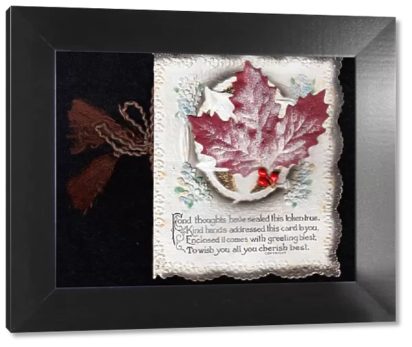 Leaves and red berries with verse on a Christmas card