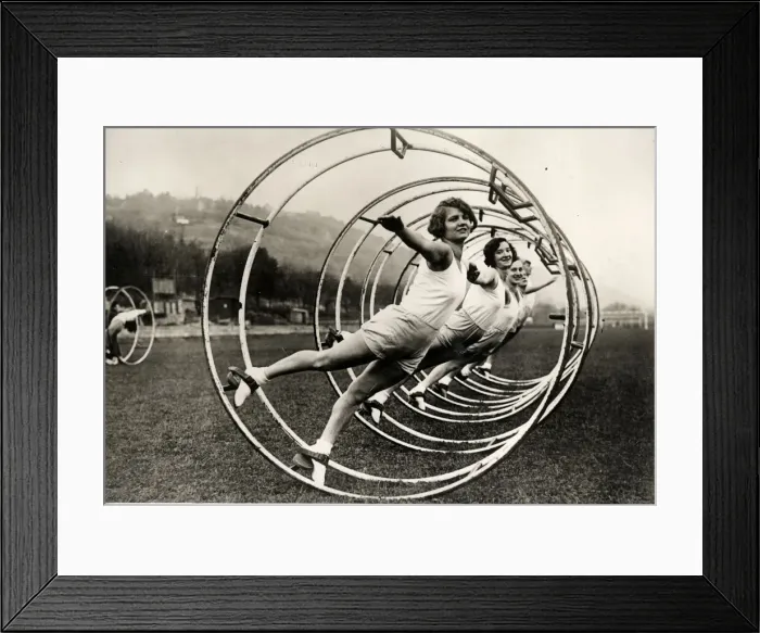 Framed Print : Women in a gymnastic wheel Framed Print : Women in a gymnastic wheel