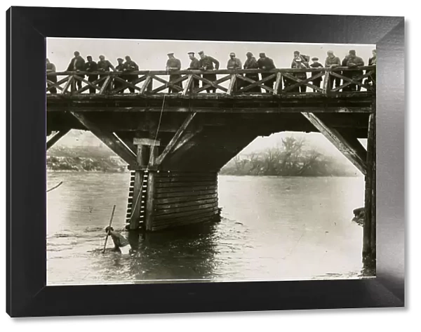 Bulgarian soldiers searching for guns in river, WW1