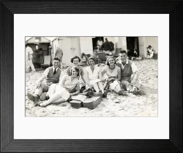Framed Print : Beach party in front of beach huts, Paignton, Devon Framed Print : Beach party in front of beach huts, Paignton, Devon