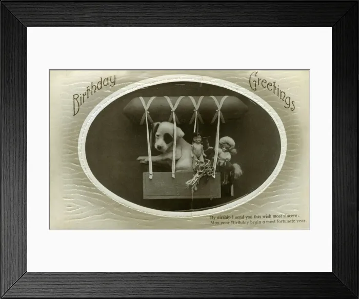 Framed Print : Birthday postcard, puppy and toys in an airship Framed Print : Birthday postcard, puppy and toys in an airship