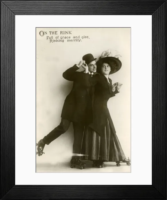 Framed Print : Couple roller skating in a studio portrait Framed Print : Couple roller skating in a studio portrait