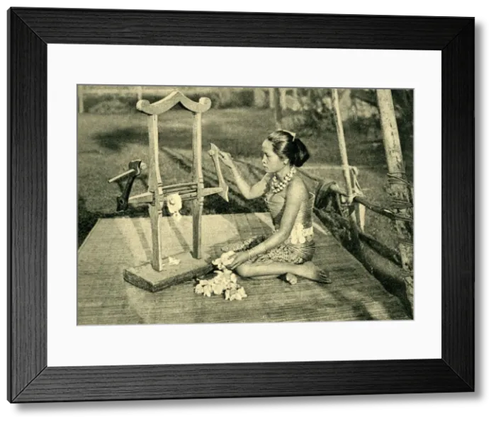 Framed Print : Sea Dayak woman making thread, Borneo, SE Asia Framed Print : Sea Dayak woman making thread, Borneo, SE Asia