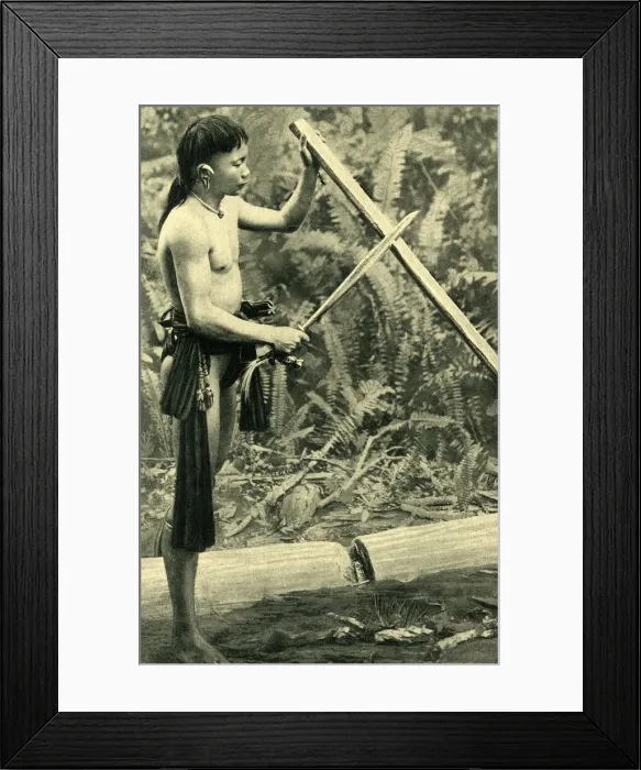 Framed Print : Young Kayan man making a blowpipe, Borneo, SE Asia Framed Print : Young Kayan man making a blowpipe, Borneo, SE Asia