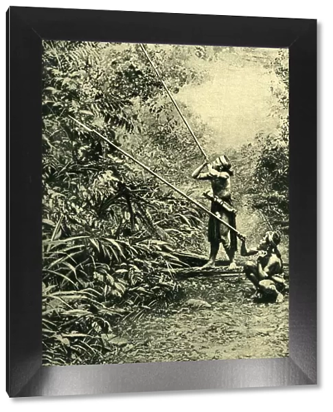 Kenyah men using their blowpipes, Borneo, SE Asia