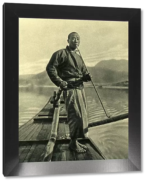 Man on his fishing boat, China, East Asia