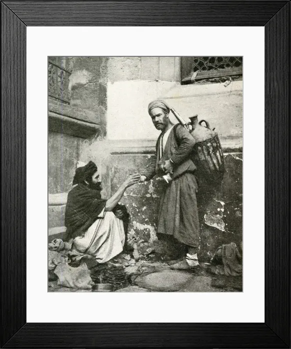 Framed Print : Water carrier handing a drink to seated man, Egypt Framed Print : Water carrier handing a drink to seated man, Egypt