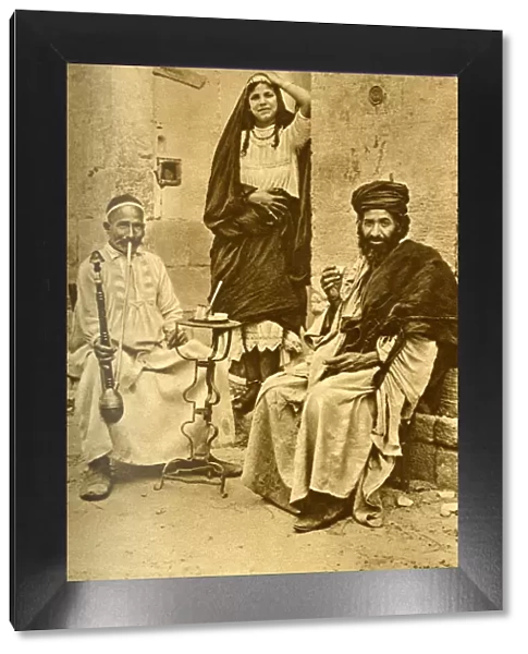 Rich man, dancing woman and beggar, Cairo, Egypt