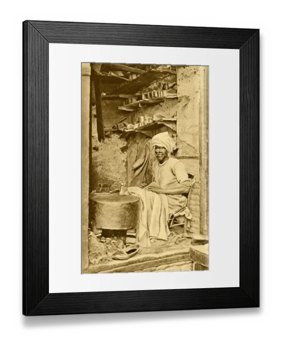 Framed Print : Arab cobbler at work in his shop, Cairo, Egypt Framed Print : Arab cobbler at work in his shop, Cairo, Egypt