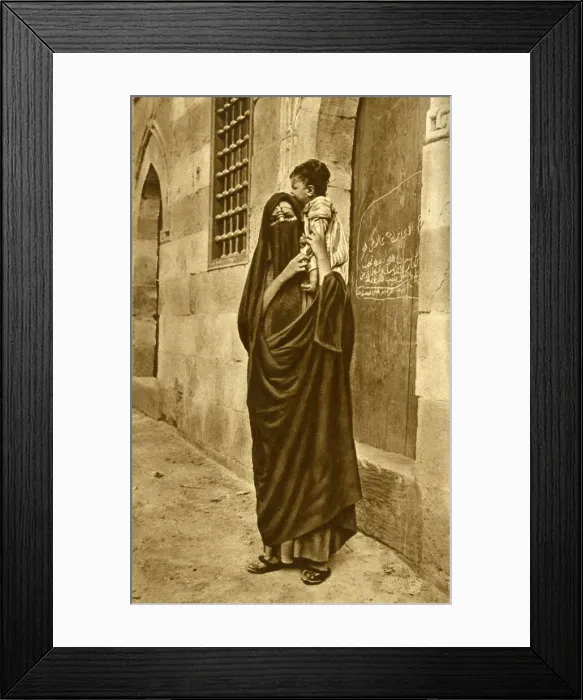 Framed Print : Woman in face veil with child on her shoulder, Cairo, Egypt Framed Print : Woman in face veil with child on her shoulder, Cairo, Egypt