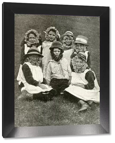 Group of children wearing wild flowers, Somerset, England