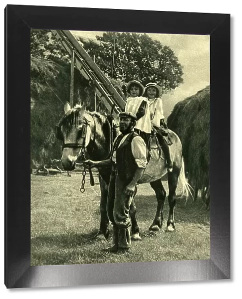 Farmer leading two children on a horse, England
