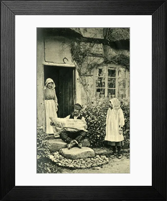 Framed Print : Man reading newspaper outside his cottage, Shropshire Framed Print : Man reading newspaper outside his cottage, Shropshire