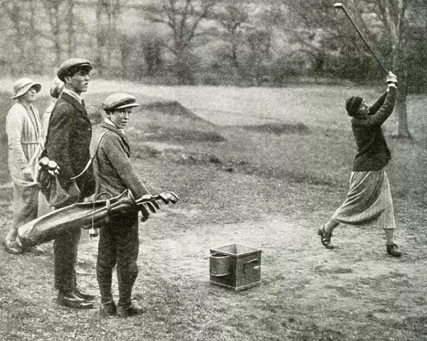 Men and women playing golf at Beaconsfield, Buckinghamshire