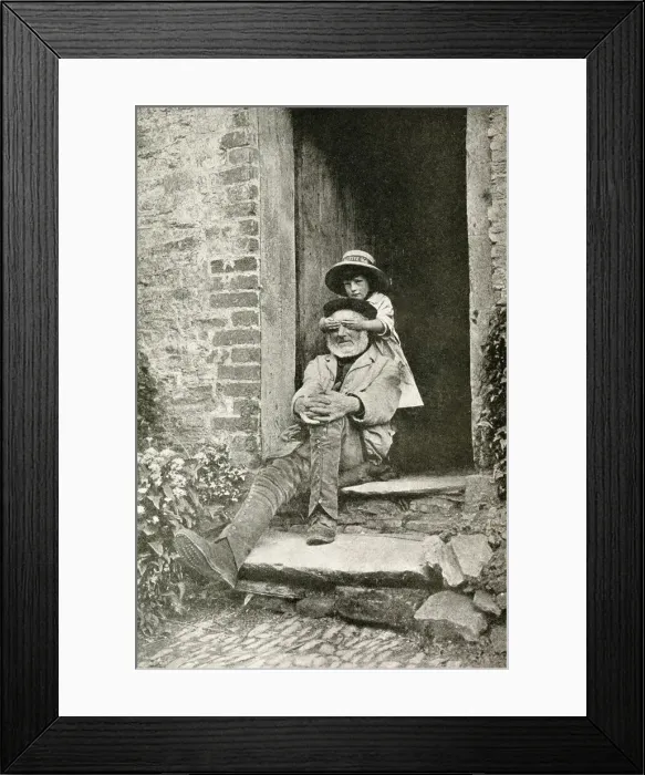 Framed Print : Grandfather and granddaughter in a doorway, England Framed Print : Grandfather and granddaughter in a doorway, England