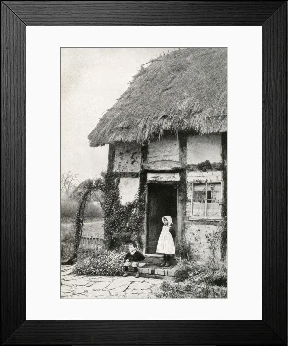 Framed Print : Boy and girl outside a thatched cottage, Worcestershire Framed Print : Boy and girl outside a thatched cottage, Worcestershire