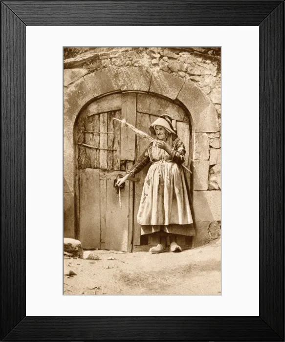Framed Print : Elderly woman with distaff and spindle, Auvergne, France Framed Print : Elderly woman with distaff and spindle, Auvergne, France