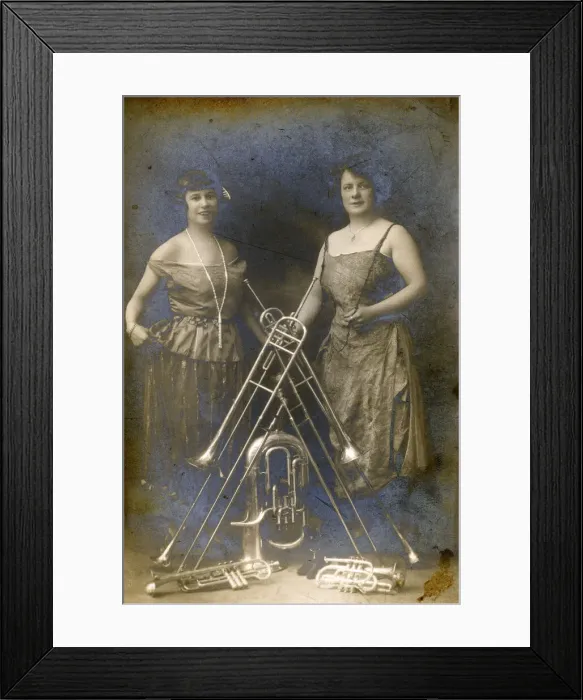 Framed Print : Two Lady Brass Musicians and a variety of their instruments Framed Print : Two Lady Brass Musicians and a variety of their instruments