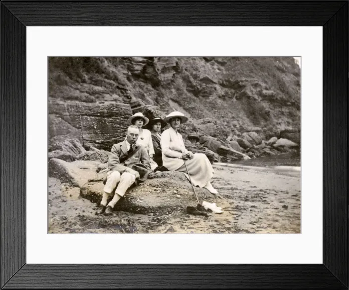 Framed Print : Family group sitting on a beach at the seaside Framed Print : Family group sitting on a beach at the seaside