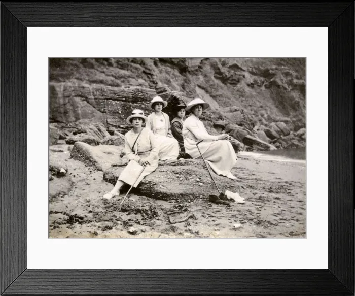 Framed Print : Family group sitting on a beach at the seaside Framed Print : Family group sitting on a beach at the seaside
