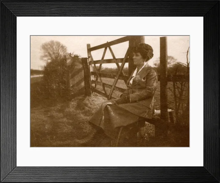 Framed Print : Woman sitting on a stile by a five-bar gate Framed Print : Woman sitting on a stile by a five-bar gate