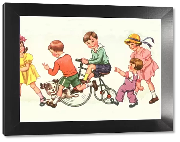 A group of children, one on a bike, and a dog