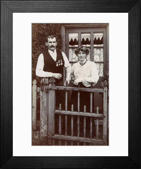 Framed Print : Couple at gate, man wearing Boer War medals Framed Print : Couple at gate, man wearing Boer War medals
