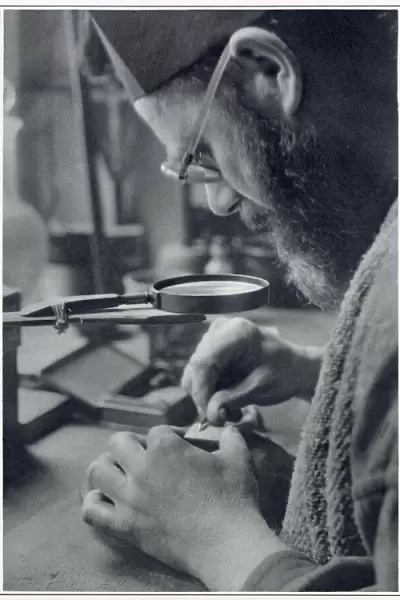 Eric Gill, sculptor and printmaker, at work